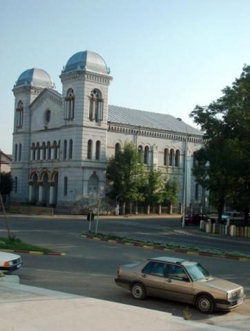 The Temple seen across the square, a parked car in the foreground