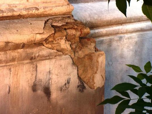 Close-up of crumbling plaster on a cornice