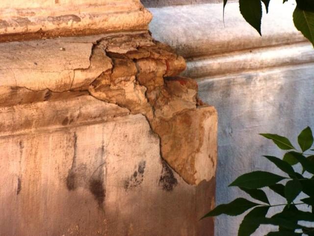 Close-up of crumbling plaster on a cornice