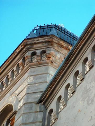 The top of a tower against a blue sky